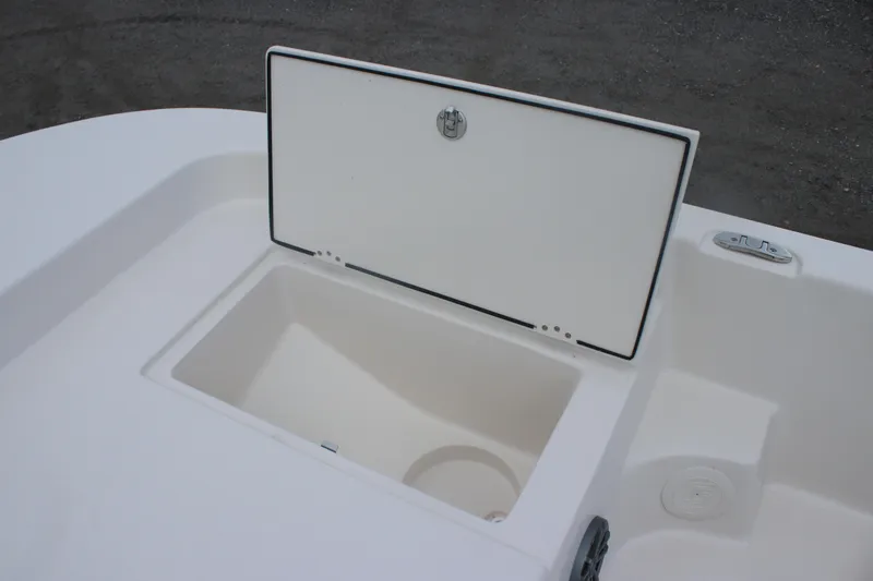 Slide: The Image of Open storage compartment on 2025 Carolina Skiff 21 LS boat. - 8