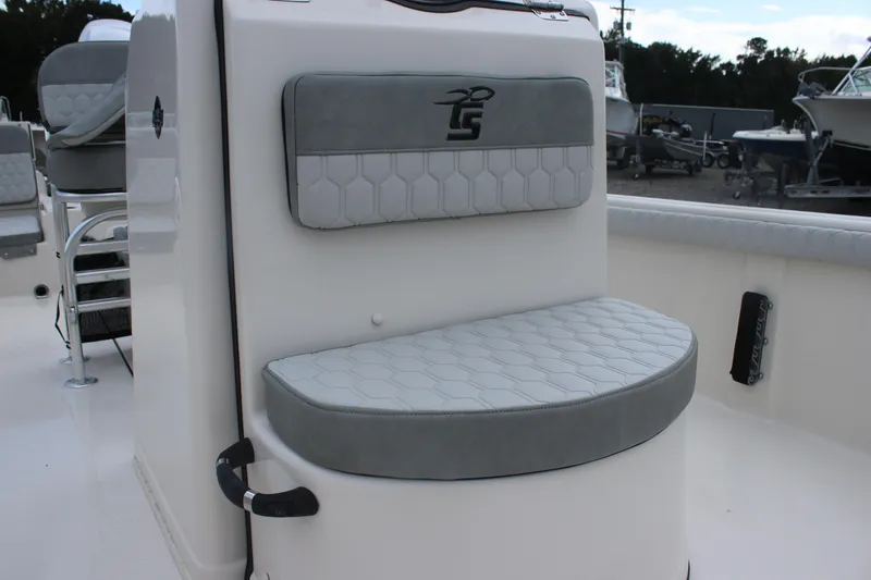Slide: The Image of 2025 Carolina Skiff 21 LS boat seat with gray cushioned upholstery. - 9