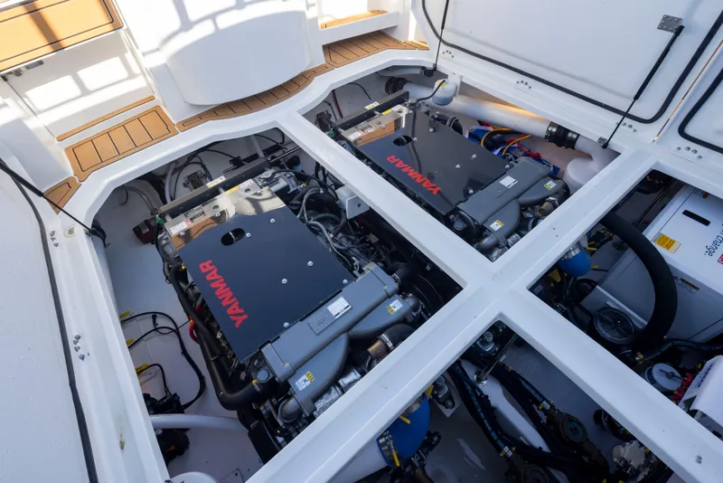 Slide: The Image of Engine compartment of 2025 Ocean Sport Roamer with dual Yanmar engines. - 31