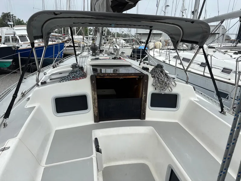 Slide: The Image of 1991 J Boats J/40 sailboat cockpit with canopy, docked in marina. - 21