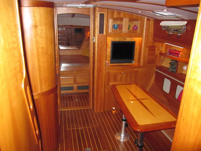 Slide: The Image of Luxurious 2005 Sabre 38 yacht interior with wooden furnishings and modern amenities. - 23