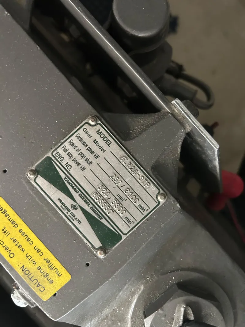 Slide: The Image of Close-up of a Sabre 38 engine label, model year 2005, showing specifications and warnings. - 26