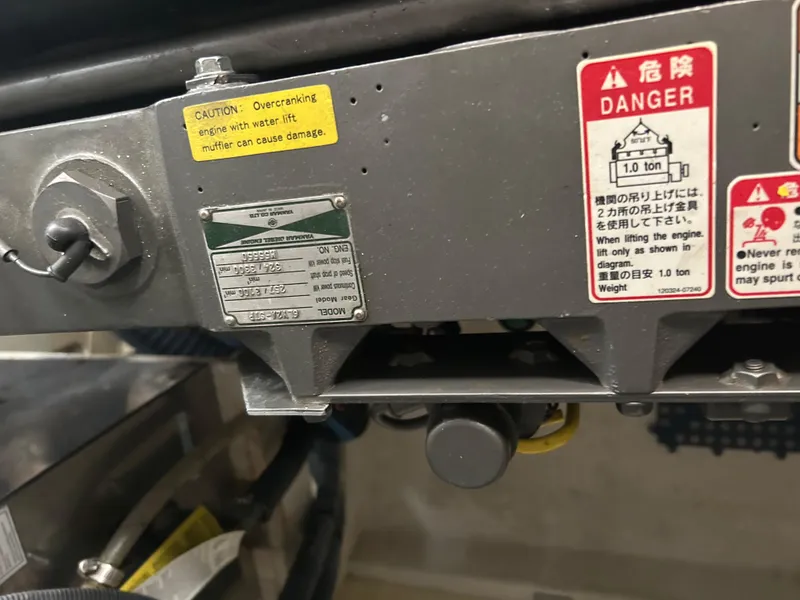 Slide: The Image of Close-up of machinery with caution and danger labels, Sabre 38, 2005 model. - 27