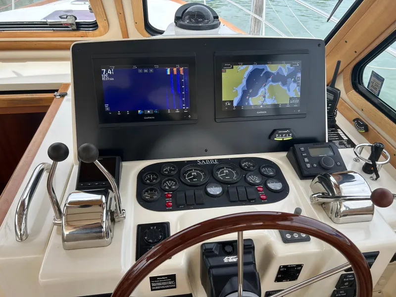 Slide: The Image of 2005 Sabre 38 yacht helm with navigation screens and controls. - 3