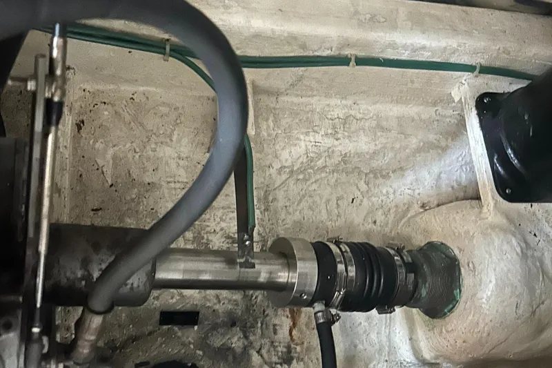 Slide: The Image of Engine compartment of a 2005 Sabre 38 boat, showing mechanical components and hoses. - 31