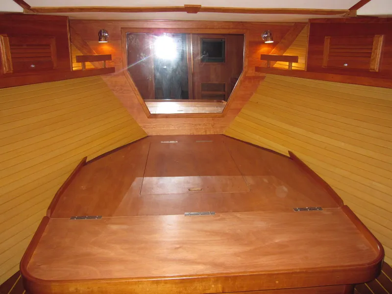 Slide: The Image of Interior cabin of a 2005 Sabre 38 sailboat with wooden furnishings and lighting. - 8