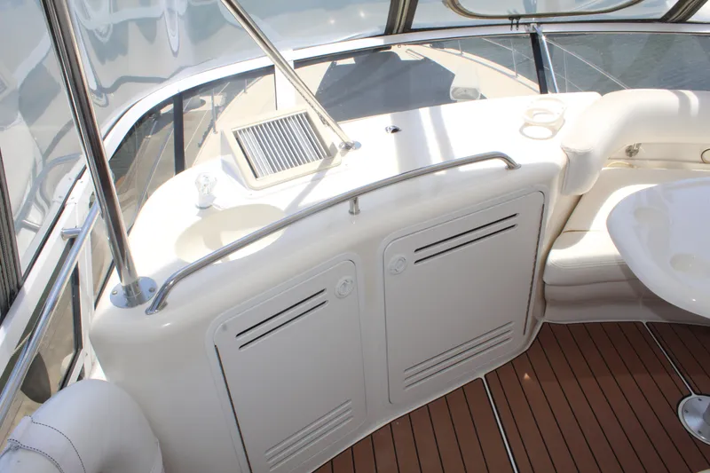 Slide: The Image of 2000 Sea Ray 480 Sedan Bridge yacht interior with sink and seating area. - 11