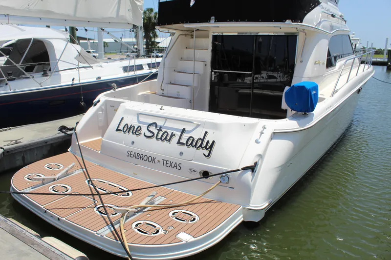 Slide: The Image of 2000 Sea Ray 480 Sedan Bridge yacht docked, named "Lone Star Lady," Seabrook, Texas. - 2