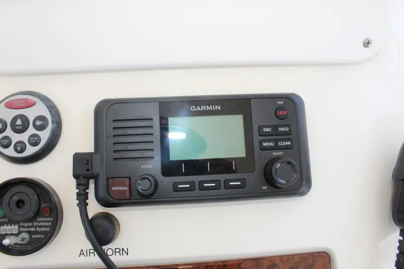 Slide: The Image of Garmin marine radio on 2000 Sea Ray 480 Sedan Bridge dashboard. - 22