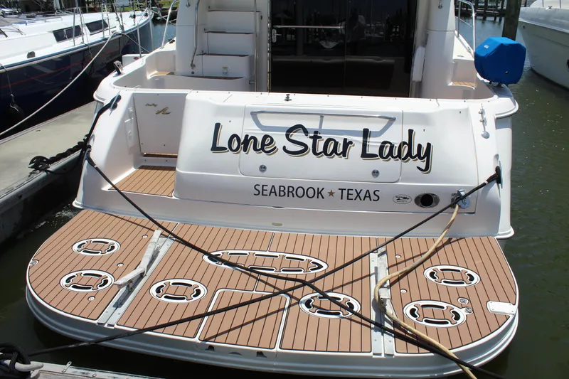 Slide: The Image of 2000 Sea Ray 480 Sedan Bridge yacht docked, named "Lone Star Lady," Seabrook, Texas. - 3