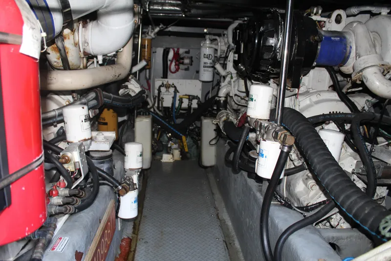 Slide: The Image of Engine room of a 2000 Sea Ray 480 Sedan Bridge yacht, showcasing mechanical components. - 43