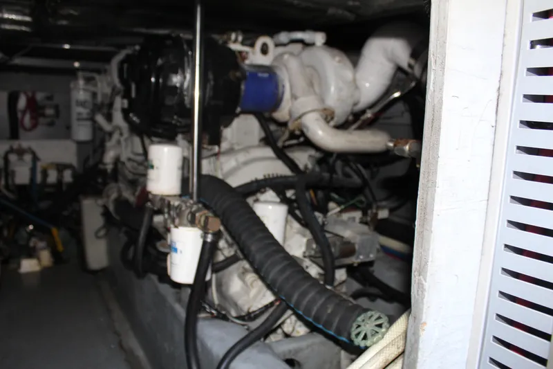 Slide: The Image of Engine room of a 2000 Sea Ray 480 Sedan Bridge yacht, showcasing mechanical components. - 44