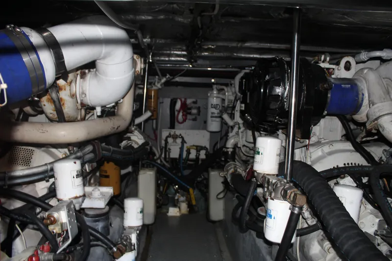 Slide: The Image of Engine room of a 2000 Sea Ray 480 Sedan Bridge yacht, showcasing mechanical components. - 46