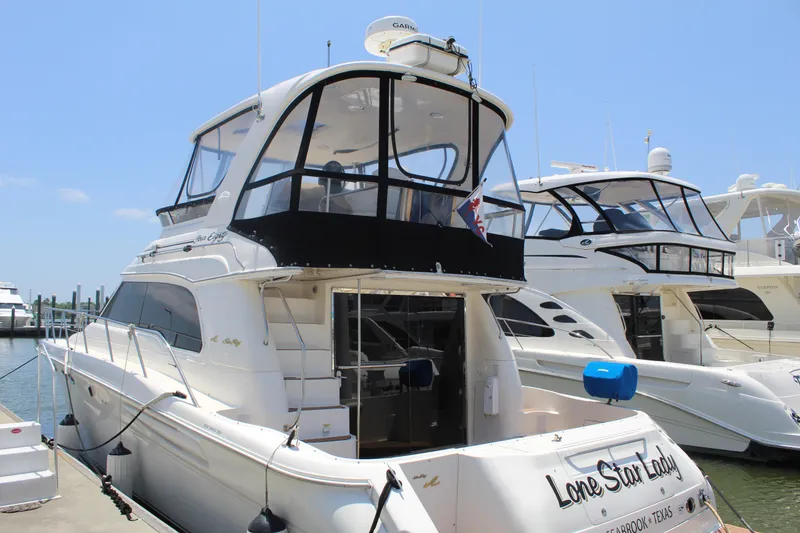 Slide: The Image of 2000 Sea Ray 480 Sedan Bridge yacht docked at marina. - 5