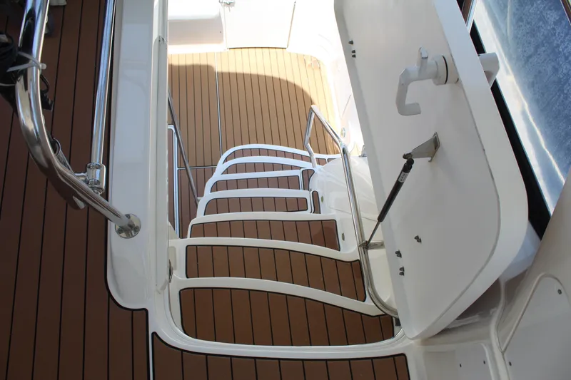 Slide: The Image of Staircase on 2000 Sea Ray 480 Sedan Bridge yacht with wooden deck. - 8