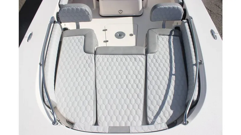 Slide: The Image of 2025 Carolina Skiff 24 Ultra Elite boat interior with cushioned seating and sleek design. - 11