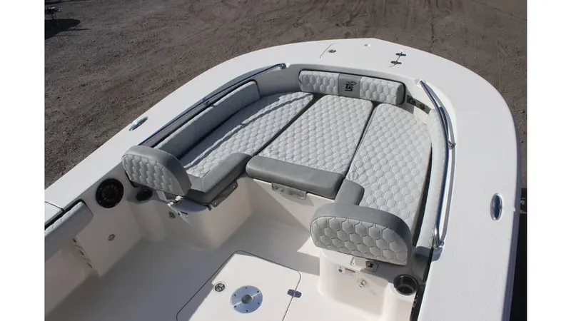 Slide: The Image of 2025 Carolina Skiff 24 Ultra Elite boat interior with cushioned seating and sleek design. - 12