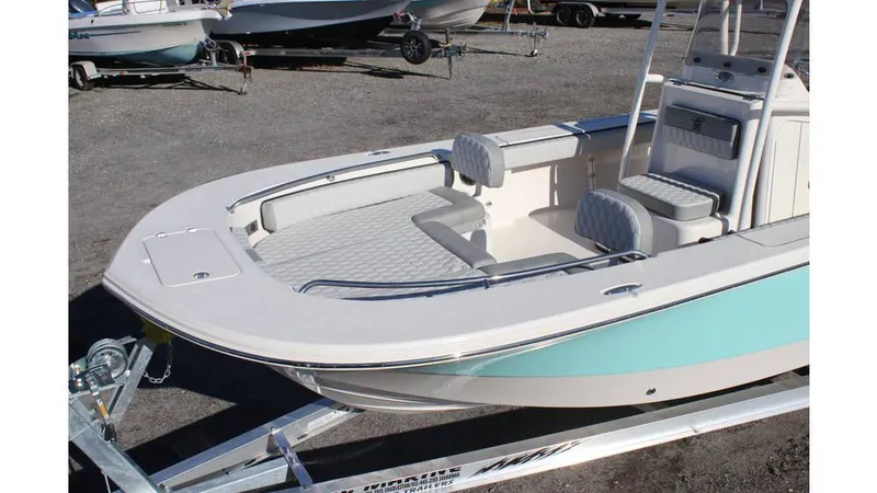 Slide: The Image of 2025 Carolina Skiff 24 Ultra Elite boat on trailer, featuring spacious seating and sleek design. - 14