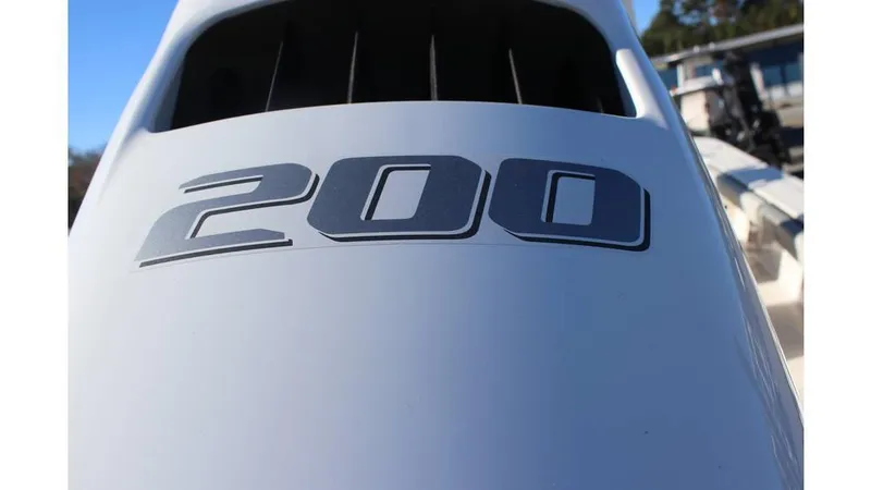 Slide: The Image of Close-up of 2025 Carolina Skiff 24 Ultra Elite boat engine with '200' decal. - 16