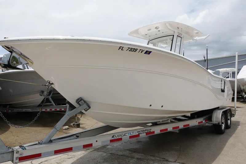 Slide: The Image of 2024 Sea Fox 268 Commander boat on trailer, displayed outdoors. - 1