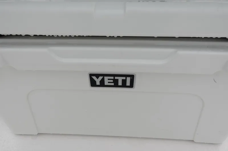 Slide: The Image of White YETI cooler on 2024 Sea Fox 268 Commander boat. - 18