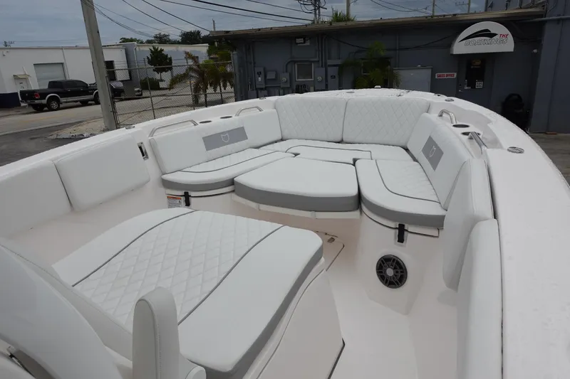 Slide: The Image of 2024 Sea Fox 268 Commander boat with spacious white seating area. - 19