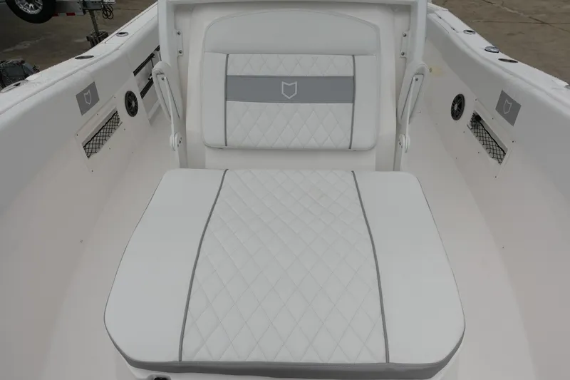 Slide: The Image of 2024 Sea Fox 268 Commander boat interior with white cushioned seating. - 23
