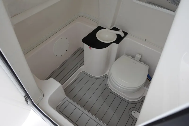Slide: The Image of 2024 Sea Fox 268 Commander boat bathroom with toilet and sink. - 28