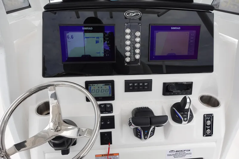 Slide: The Image of 2024 Sea Fox 268 Commander dashboard with dual Simrad displays and modern controls. - 4