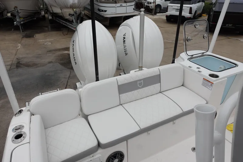 Slide: The Image of 2024 Sea Fox 268 Commander boat with Yamaha engines and white seating area. - 7