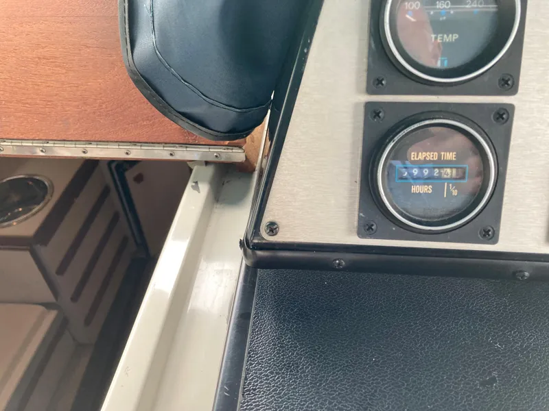 Slide: The Image of 1988 Carver 3257 Montego dashboard with elapsed time gauge and temperature dial. - 18