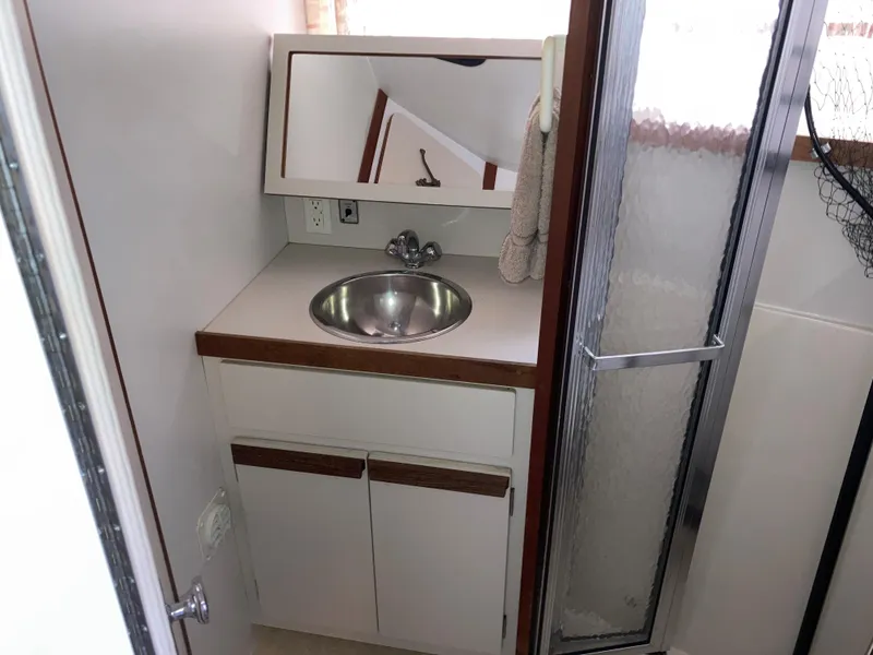 Slide: The Image of 1988 Carver 3257 MONTEGO bathroom with sink, mirror, and shower. - 24