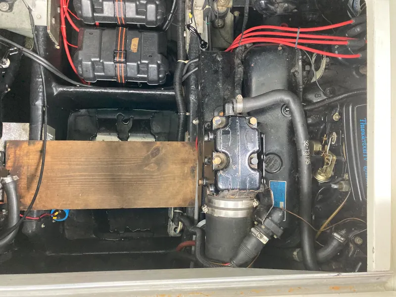 Slide: The Image of 1988 Carver 3257 MONTEGO engine compartment with visible components and wiring. - 27
