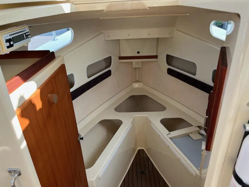 Slide: The Image of 2001 Rosborough RF-246 Custom Wheelhouse interior with wood accents and storage compartments. - 5