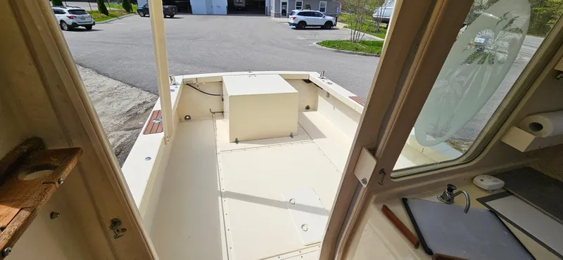 Slide: The Image of 2001 Rosborough RF-246 Custom Wheelhouse boat interior, showcasing spacious deck and wheelhouse view. - 9