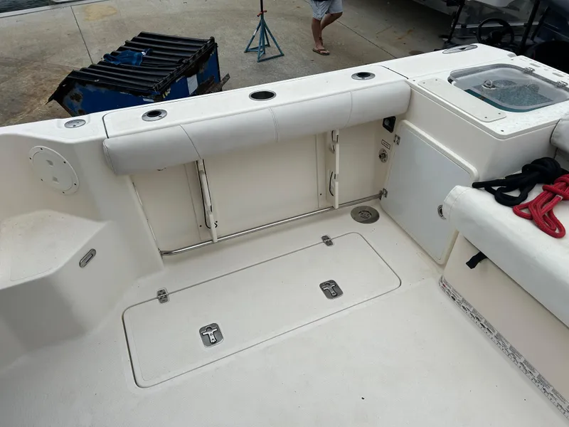 Slide: The Image of 2011 Pursuit OS 315 Offshore boat deck with storage compartments and seating. - 6