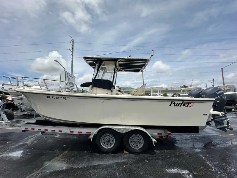 Slide: The Image of Parker 2500 Special Edition 2011 boat on trailer under cloudy sky. - 4