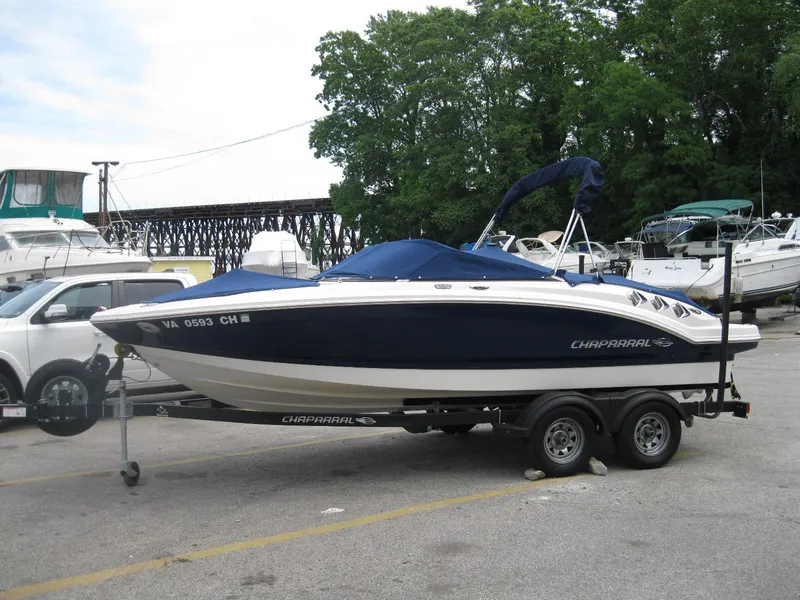 The Image of 2012 Chaparral 206 SSi boat on trailer, parked in marina lot. - 0