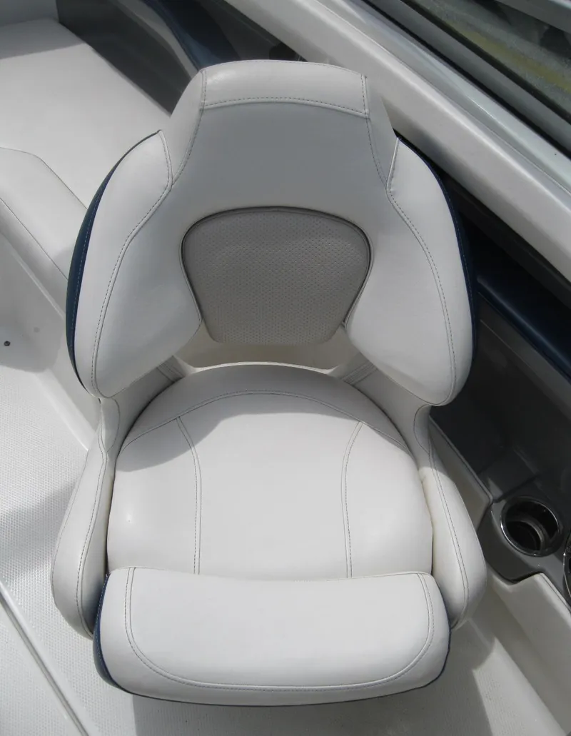 Slide: The Image of White leather seat in a 2012 Chaparral 206 SSi boat. - 14