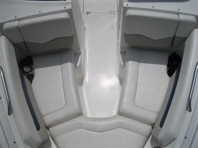 Slide: The Image of 2012 Chaparral 206 SSi boat interior with white seating and spacious layout. - 16