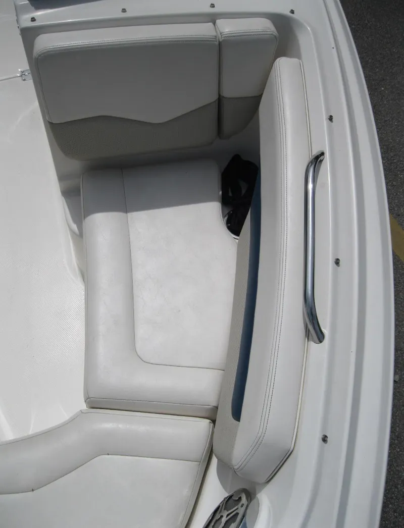 Slide: The Image of 2012 Chaparral 206 SSi boat interior with white seating and stainless steel handle. - 18