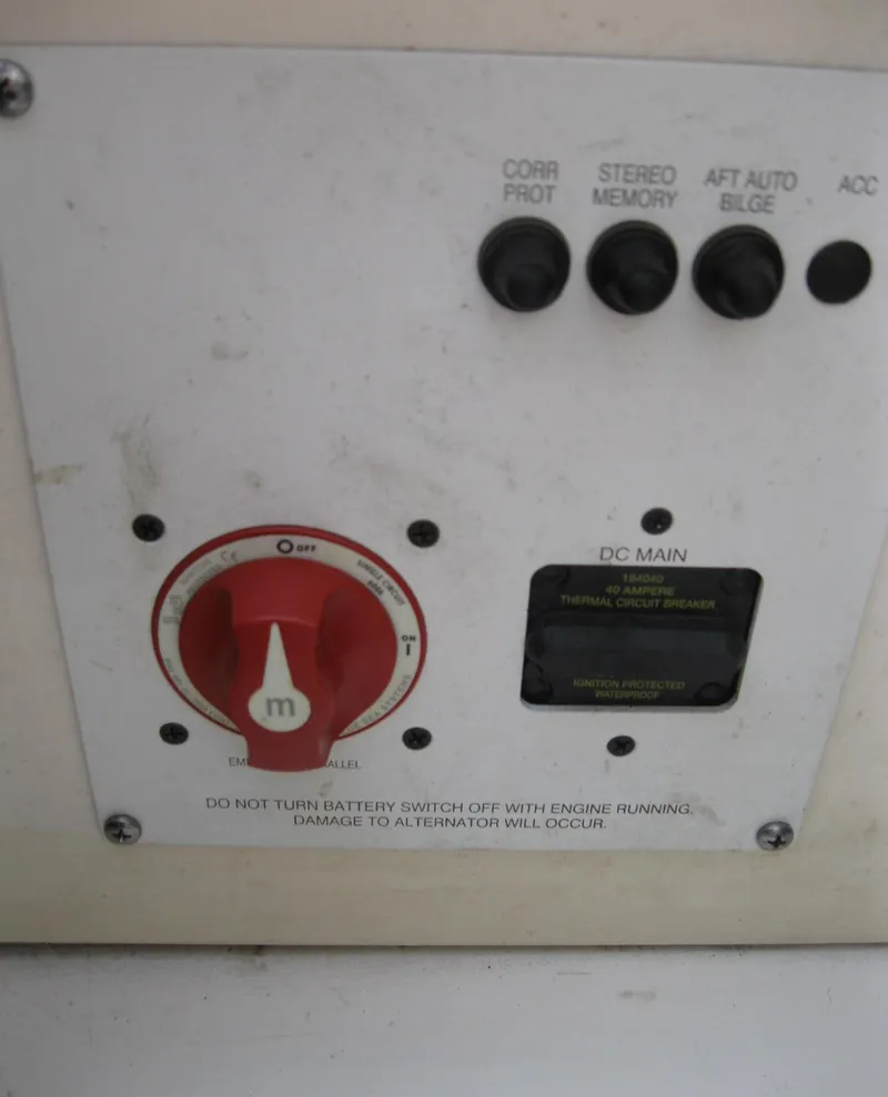 Slide: The Image of Control panel of a 2012 Chaparral 206 SSi boat with switches and battery dial. - 23