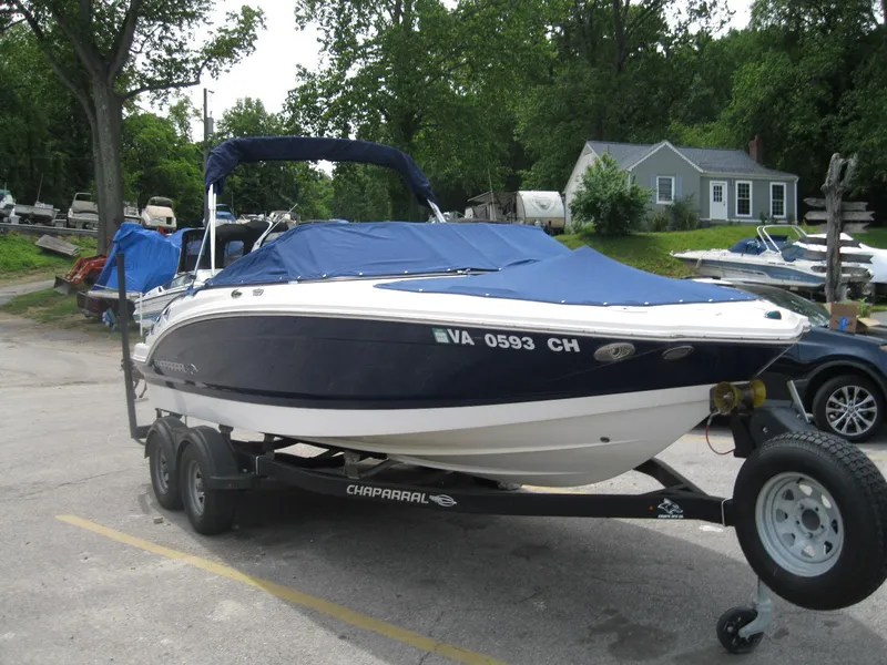 Slide: The Image of 2012 Chaparral 206 SSi boat on trailer, covered, parked outdoors. - 3