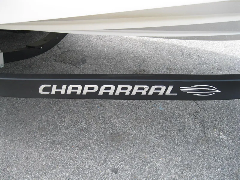 Slide: The Image of Chaparral 206 SSi 2012 boat trailer with logo on pavement background. - 32