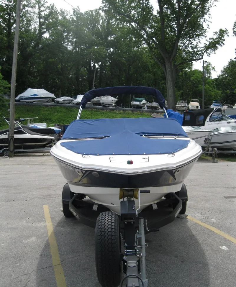Slide: The Image of 2012 Chaparral 206 SSi boat on trailer, covered, parked outdoors. - 5