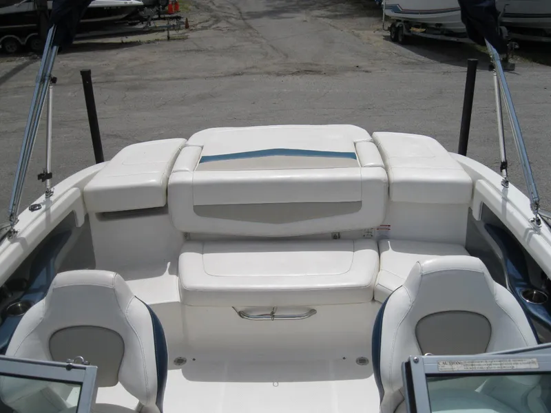 Slide: The Image of 2012 Chaparral 206 SSi boat interior with white seating and open deck layout. - 8
