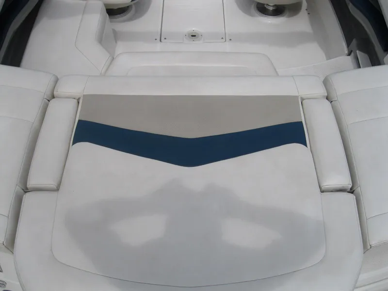 Slide: The Image of 2012 Chaparral 206 SSi boat interior with white and blue seating. - 9