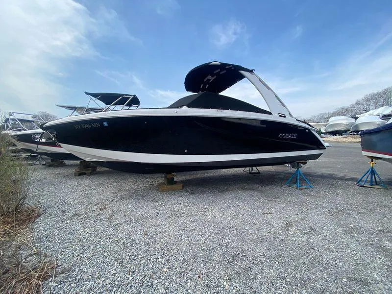 Slide: The Image of 2018 Cobalt R5 boat on gravel, with blue sky background. - 1