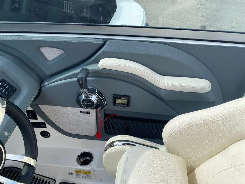 Slide: The Image of Interior of a 2018 Cobalt R5 boat, featuring steering wheel and control panel. - 10
