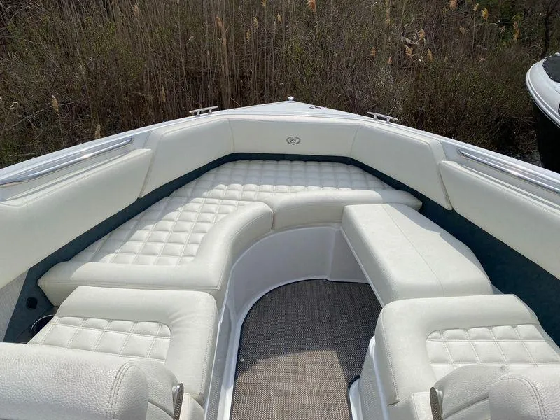 Slide: The Image of 2018 Cobalt R5 boat with white cushioned seating in the bow area. - 11